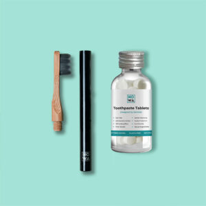 toothpaste tab and bamboo brush
